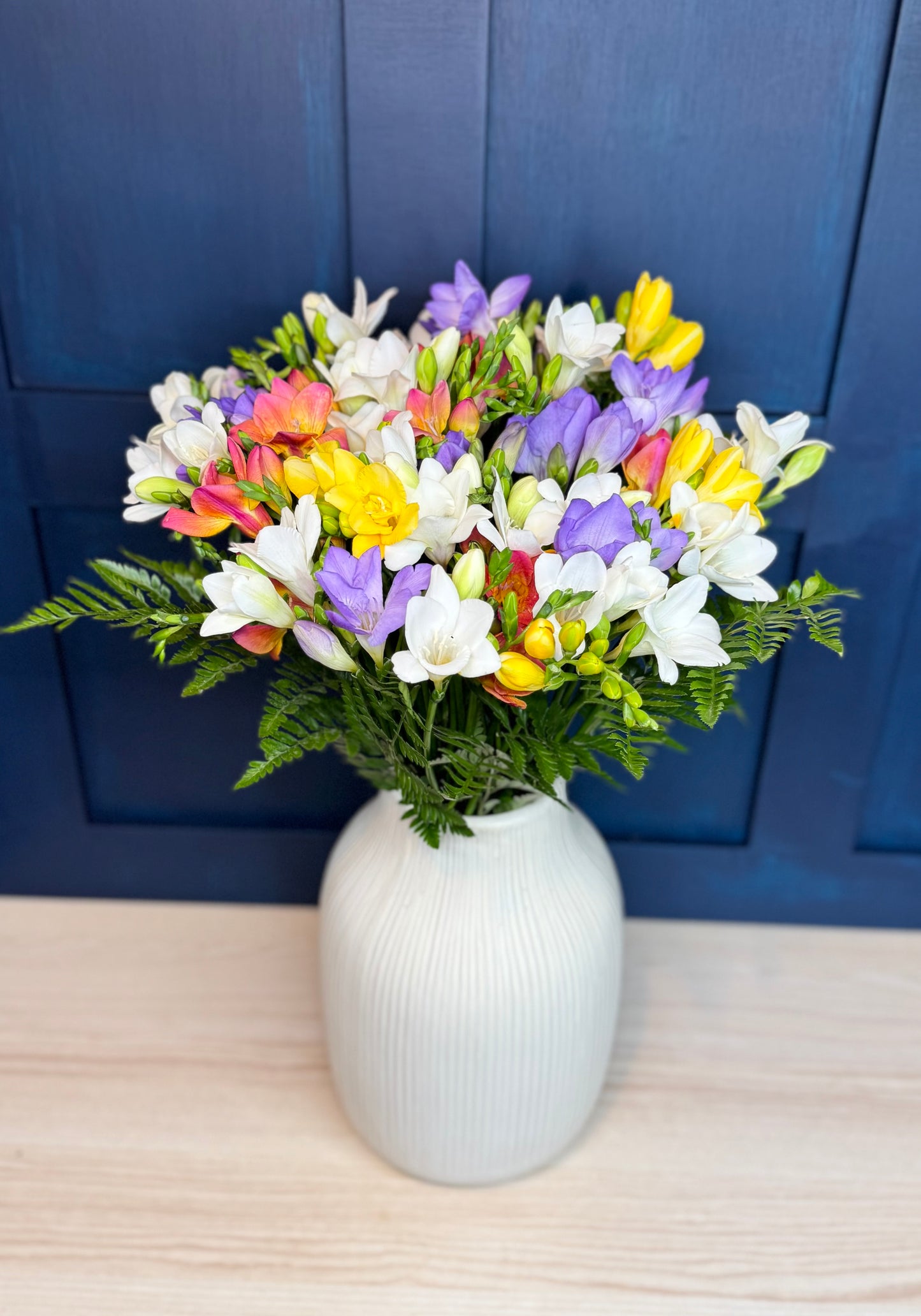 Mixed freesia bouquet in pastel shades, hand-tied arrangement, available for free UK delivery from FlowersByPost.com