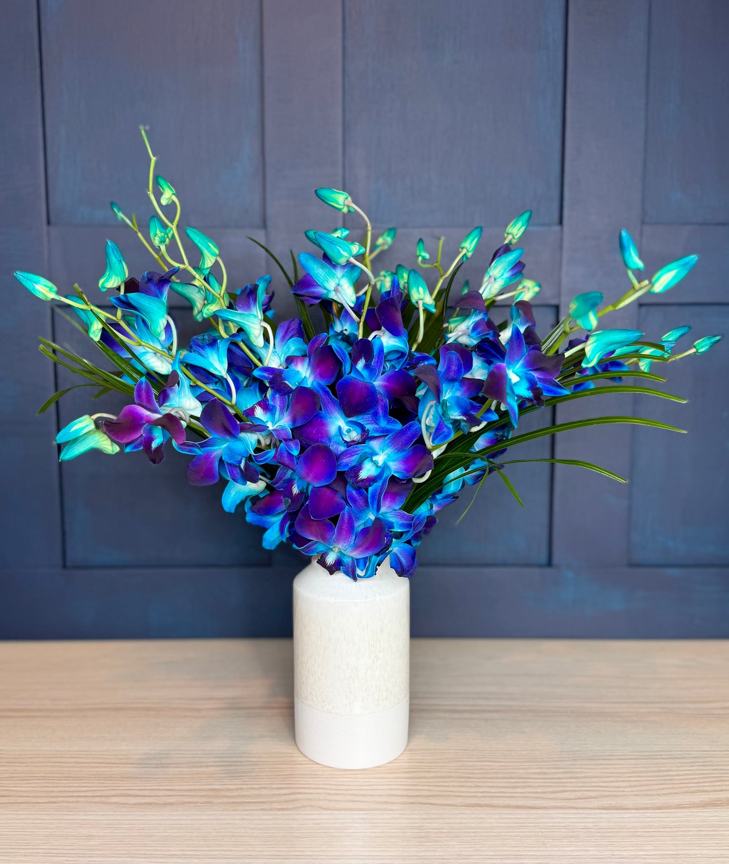 Electric blue orchid bouquet, hand-tied and available for free UK delivery from FlowersByPost.com